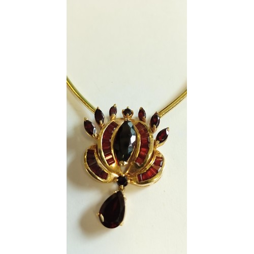 143 - 14ct Italian gold necklace with stone mounted pendant possibly garnet 30g approx.