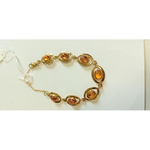 148 - 9ct gold amber bracelet 13.9g approx.