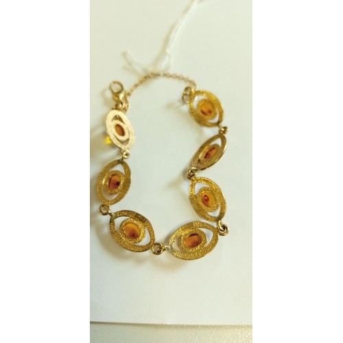 148 - 9ct gold amber bracelet 13.9g approx.