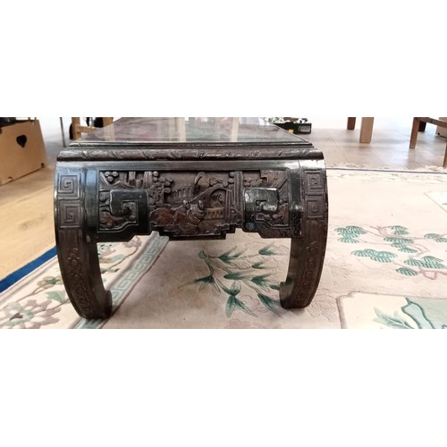 295 - Oriental carved coffee table with glass inlay