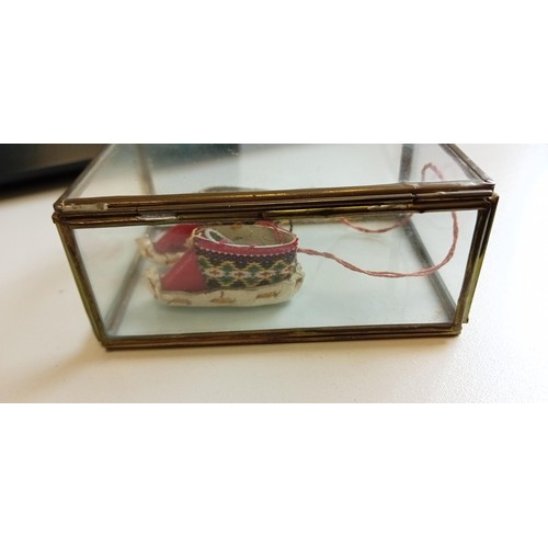 64 - Vintage display box with miniature innuit shoes