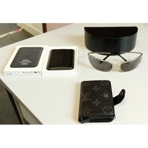 70 - Pair of Vintage Prada sunglasses in a case, credit card holder and Iphone leather wallet all with tr... 