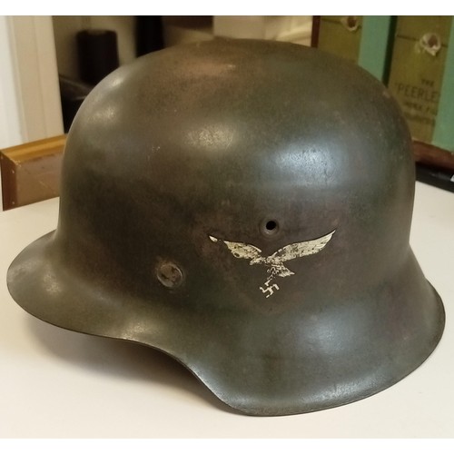 84 - WWII German helmet believed M40 with original paint complete with liner and strap