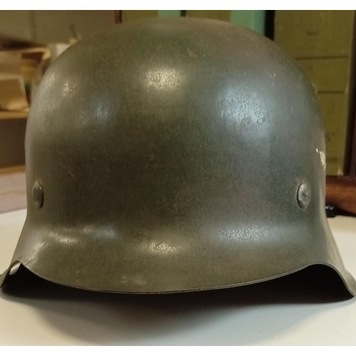 84 - WWII German helmet believed M40 with original paint complete with liner and strap