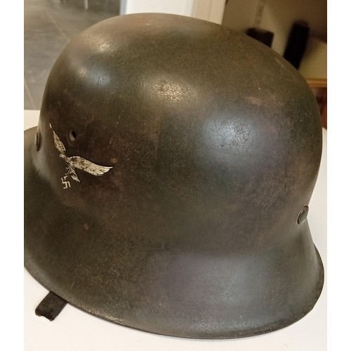 84 - WWII German helmet believed M40 with original paint complete with liner and strap