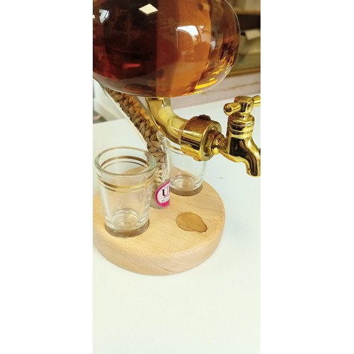 129 - Miniature glass whisky still with 2 dram glasses