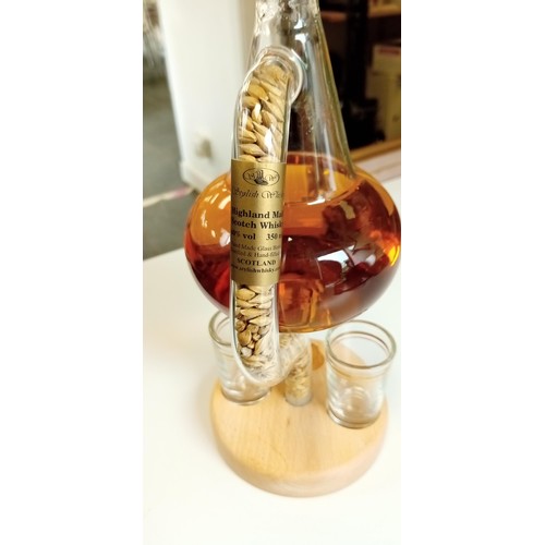 129 - Miniature glass whisky still with 2 dram glasses