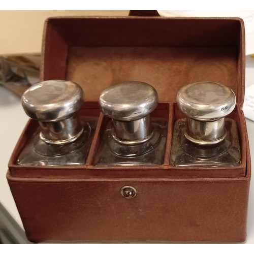 128 - 19th Century silver topped cologne decanters in leather case A/F see photos for damage