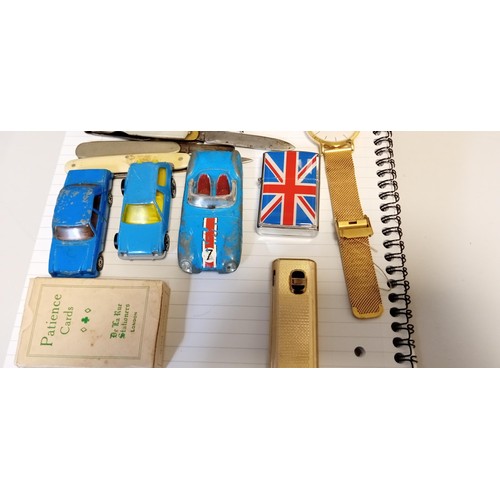 131 - Selection of vintage collectables to include pen knives, lighters and toy cars