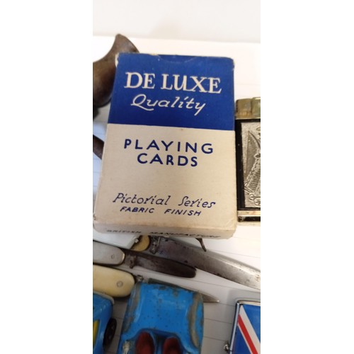 131 - Selection of vintage collectables to include pen knives, lighters and toy cars