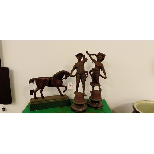 31 - Pair of vintage cast statues and a horse doorstop