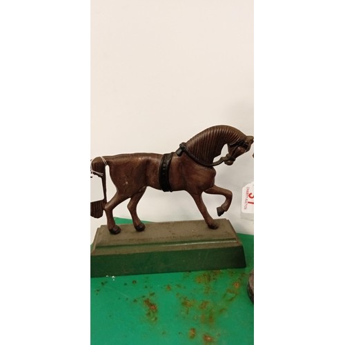 31 - Pair of vintage cast statues and a horse doorstop