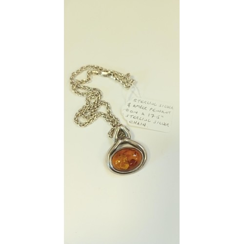 189 - Sterling silver & amber pendant on a 17.5