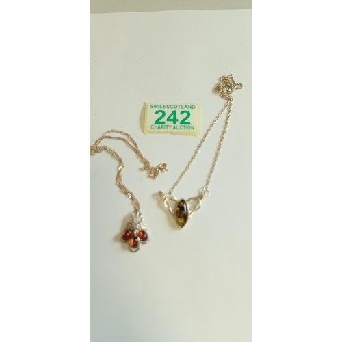 242 - Pair of sterling silver and amber necklaces