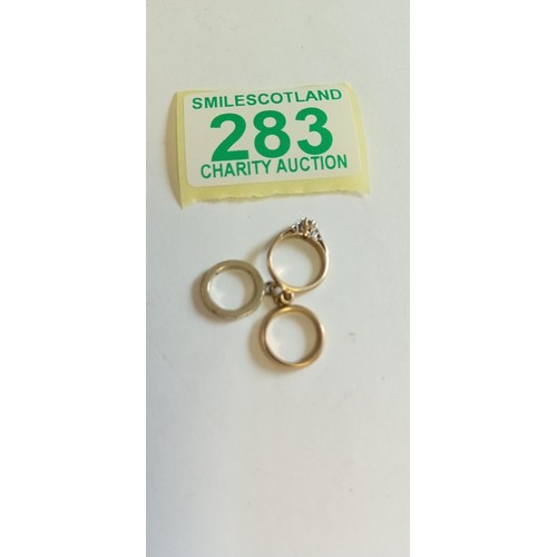 283 - Fully hallmarked 9ct 3 ring charms, engagement, wedding and eternity rings weighs 2.9g approx.