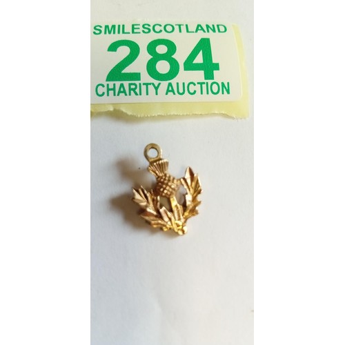 284 - Fully hallmarked 9ct gold double sided thistle charm weighs 3.1g approx