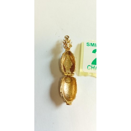 285 - Fully hallmarked 14k gold pineapple hinged charm weighs 6.3g approx