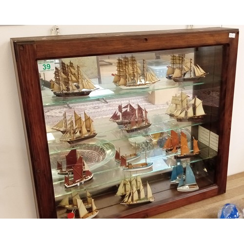 39 - Glass presentation cabinet with 12 model boats in Cornwall 1976