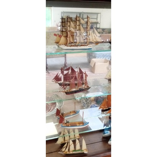 39 - Glass presentation cabinet with 12 model boats in Cornwall 1976