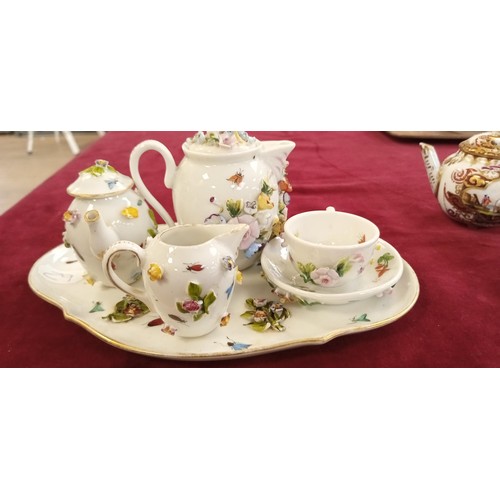 111 - Miniature raised tea set and others