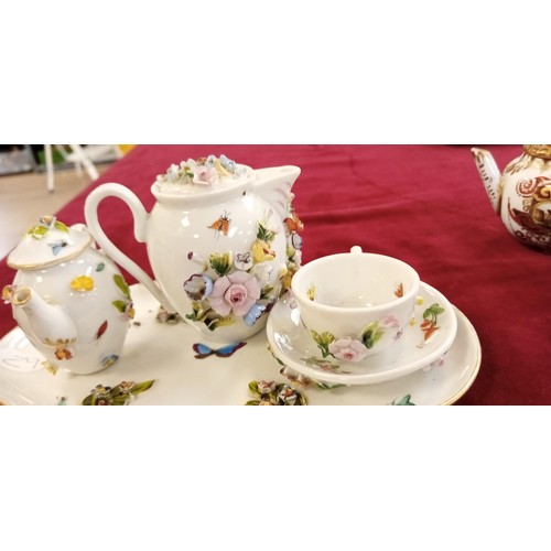 111 - Miniature raised tea set and others