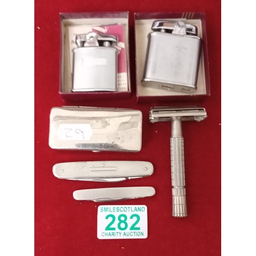 282 - 2 Ronson lighters, pen knives and shaving equipment