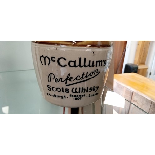 295 - McCallum's perfection Scots whisky flagon