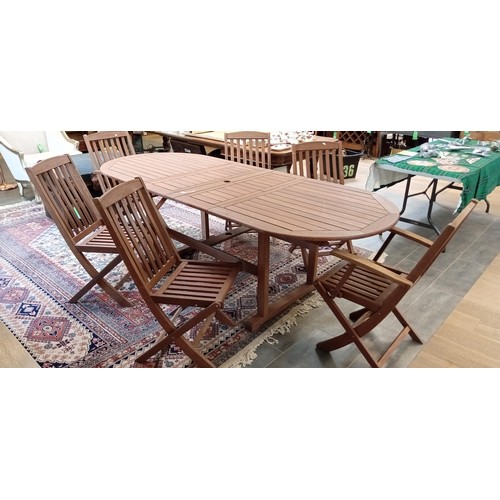 315 - Hardwood extending garden table with 2 carvers & 4 chairs