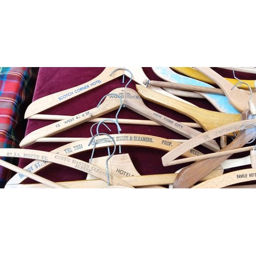 397 - Large selection of wooden coat hangers to include Savoy Hotel, White Horse Whisky, Woodstock hotel a... 