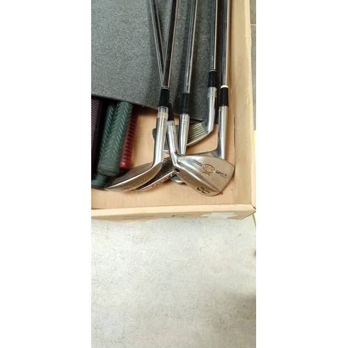 414 - Box of golf clubs