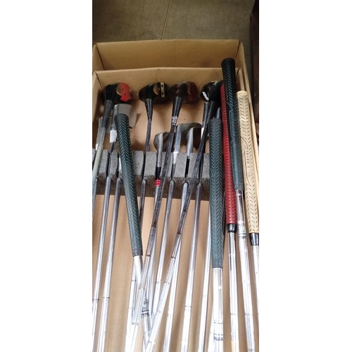 414 - Box of golf clubs