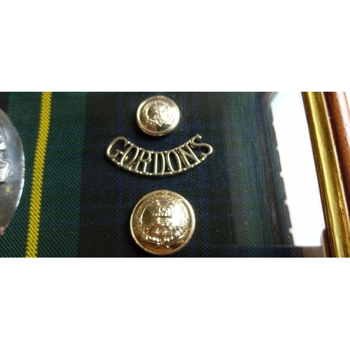 91 - Vintage Gordon Highlander Bydand badges and plaid badges in a presentation case