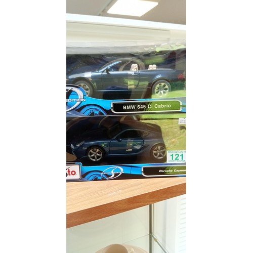 121 - 2 model cars by Maisto Porche Cayman S, BMW 64 Cabrio