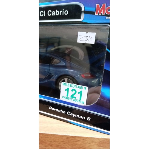 121 - 2 model cars by Maisto Porche Cayman S, BMW 64 Cabrio