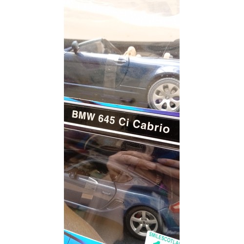 121 - 2 model cars by Maisto Porche Cayman S, BMW 64 Cabrio