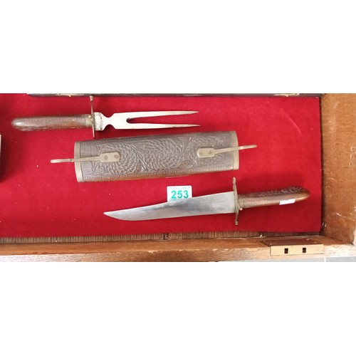 253 - Oriental carving set in wooden sheath