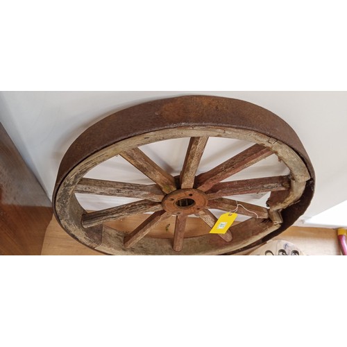 17 - Antique wooden and metal cartwheel