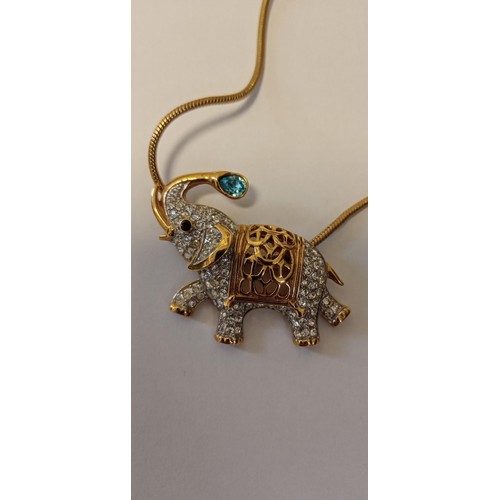 40 - Elephant pendant/ brooch on a yellow metal chain