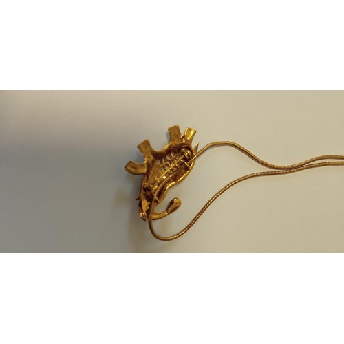 40 - Elephant pendant/ brooch on a yellow metal chain