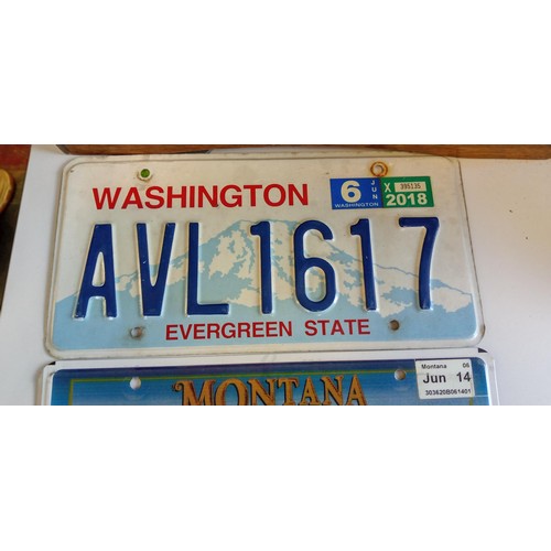 51 - Selection of American number plates some with month and year tabs