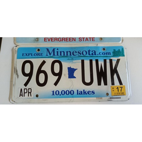 51 - Selection of American number plates some with month and year tabs