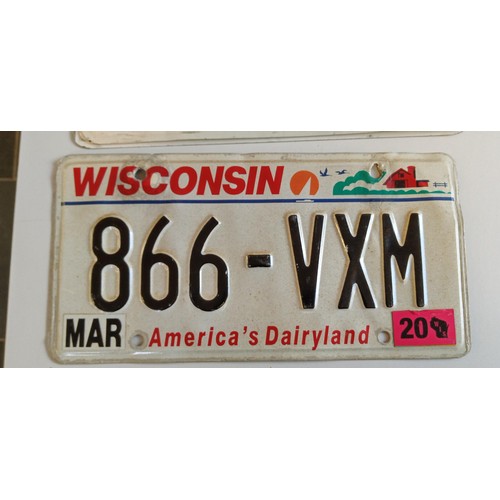 51 - Selection of American number plates some with month and year tabs