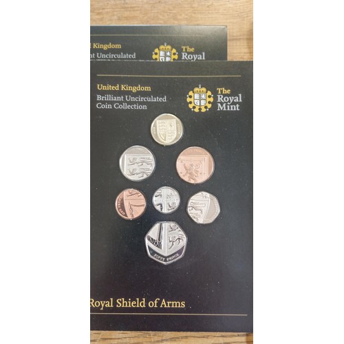 65 - 2 x The Royal Mint uncirculated coin collections Emblems of Britain and Royal Shield of Arms