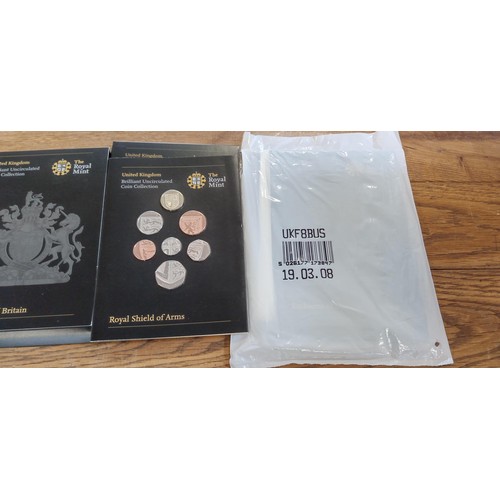 65 - 2 x The Royal Mint uncirculated coin collections Emblems of Britain and Royal Shield of Arms