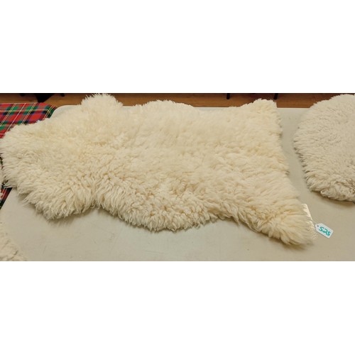 525 - Genuine sheepskin rug measures 1m long approx.