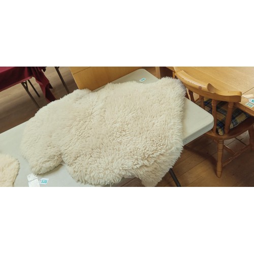 526 - Sheepskin rug measures 90cm long approx.