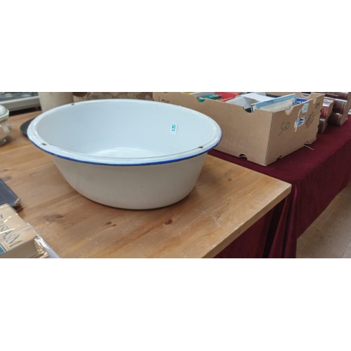 561 - Large enamel oval white and blue basin