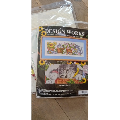 10 - Box of cross stitch patterns of mainly new