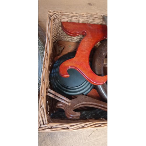 32 - Basket full of wooden objects to include stands, book ends and more