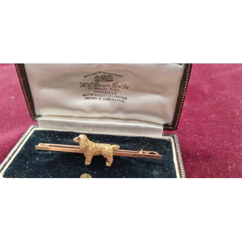 88 - Vintage yellow metal dog brooch 3.3g approx.  In an original brooch box